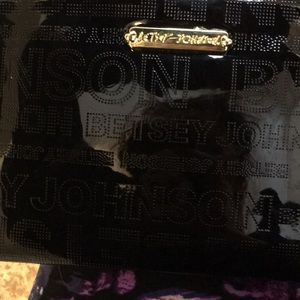 Betsy Johnson clutch with built in phone charger